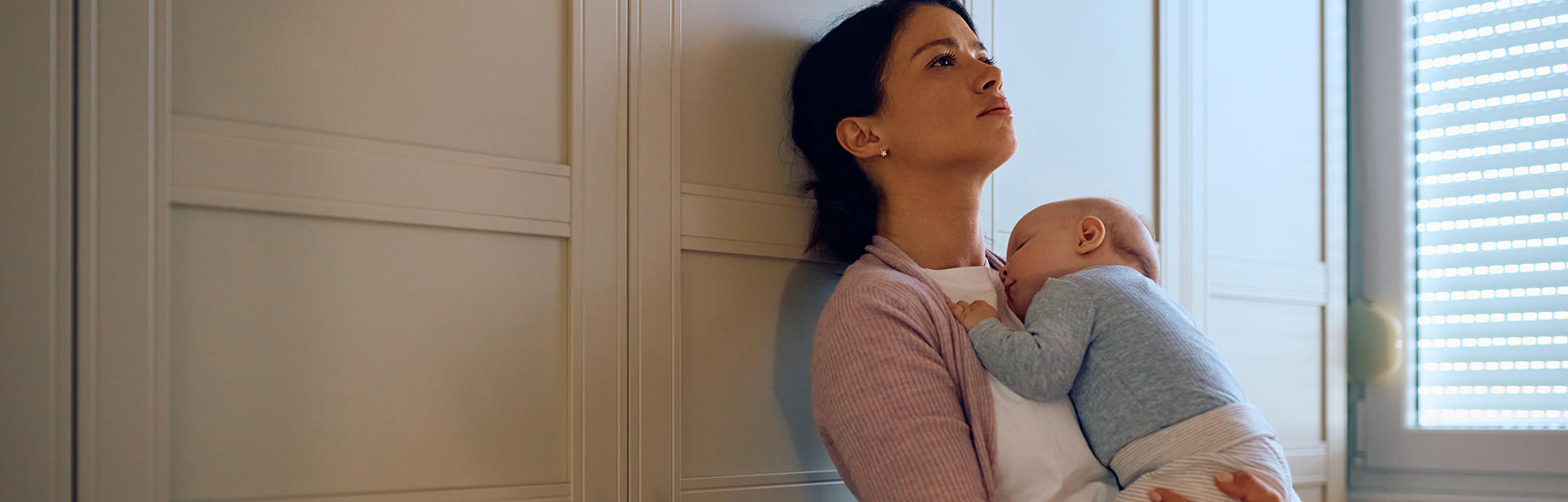 sad-mother-holding-baby