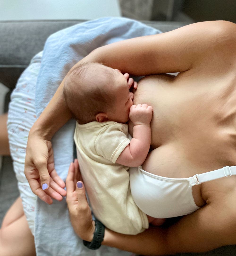 Mother breastfeeding newborn baby