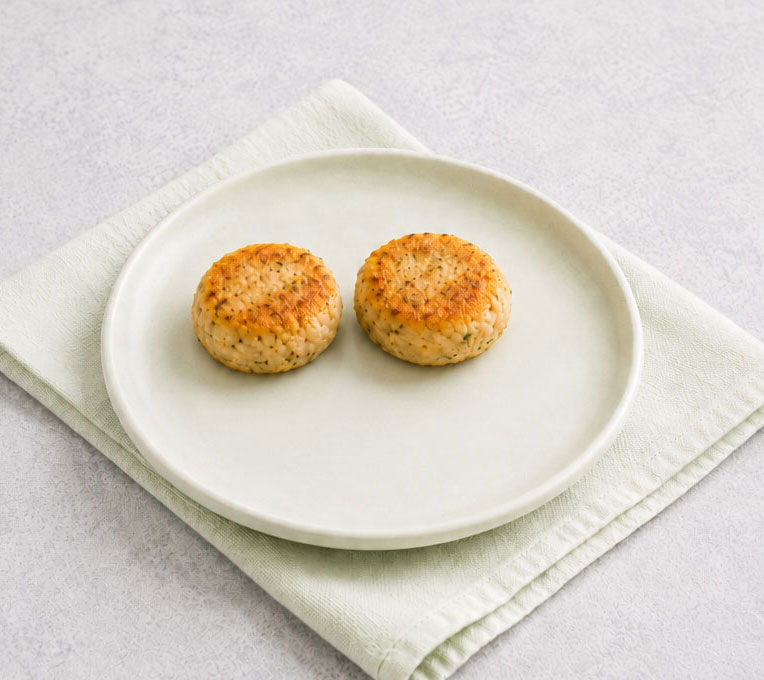 Golden tuna cakes on plate