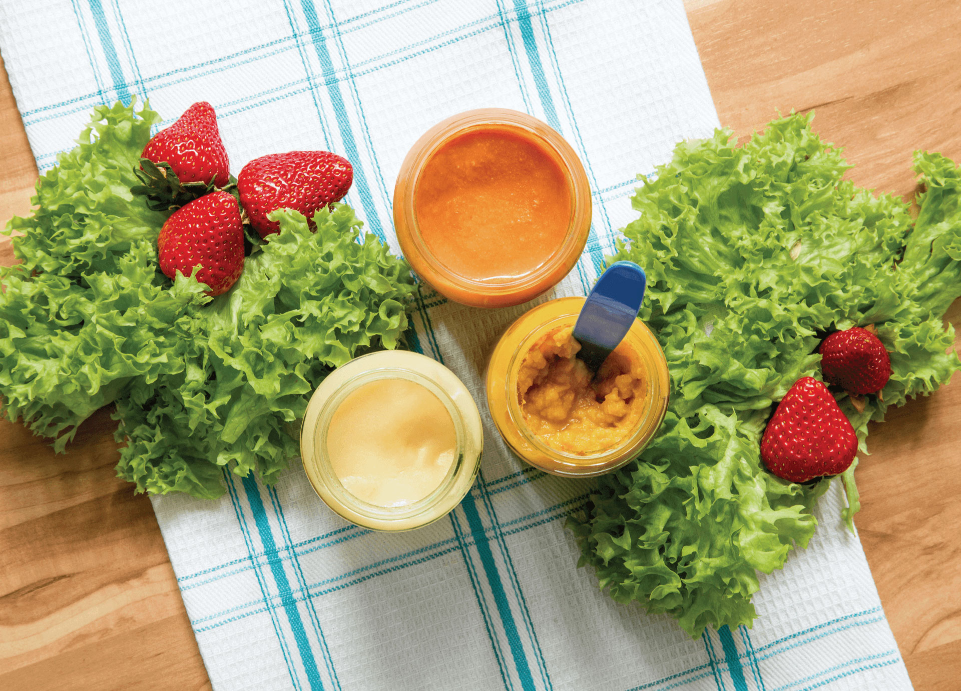 Mom and toddler eating veggie smiling