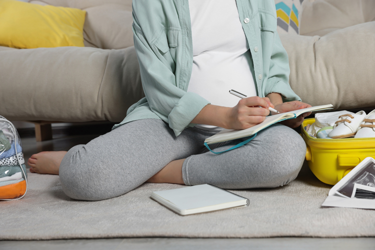 mom sitting on floor planning